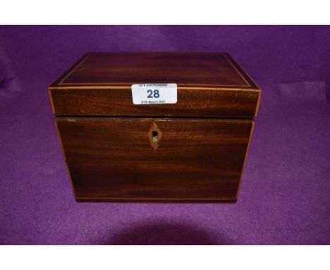 An antique tea caddy having mahogany case with inlayed detailing and foiled compartments