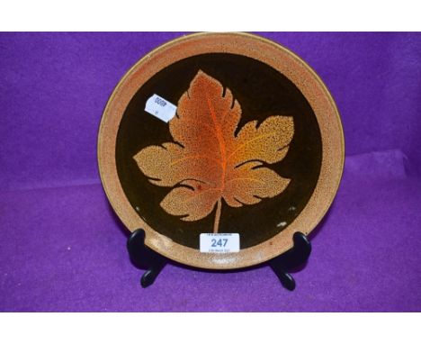 A mid century dish by Poole having naturalistic glaze and imagery