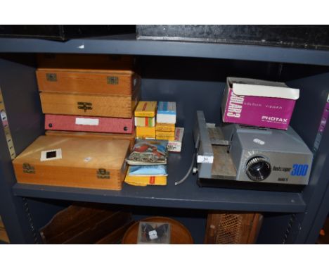 A selection of photographic slides and Boots super 300 model ii projector
Mostly family and some street scenes etc