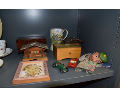 A selection of musical jewellery boxes and ceramic headed puppet