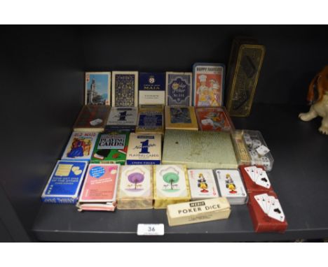 A selection of poker and playing cards including bridge and poker dice