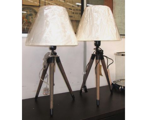 TABLE LAMPS, a pair, grey wood with black and brass finish tripod with silk shade, 71cm H. (2)