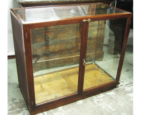 SHOP DISPLAY CABINET, early 20th century mahogany with two doors fitted a glass shelf, 107cm x 53cm x 94cm H.