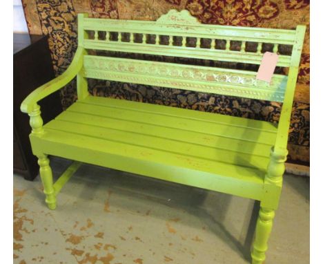 BENCH, three seater, painted green with slatted seat, 113cm x 91cm H x 60cm. (with faults)