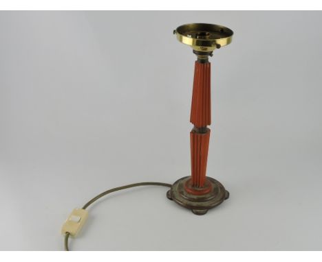 An Art Deco style table light, with an orange lucite support of square reeded form on a circular stepped base, H. 31cm  