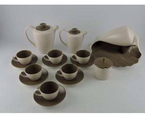 A Poole Pottery Twin-Tone tea service for six place settings; in Sepia & Mushroom colourway, together with a similar conch sh
