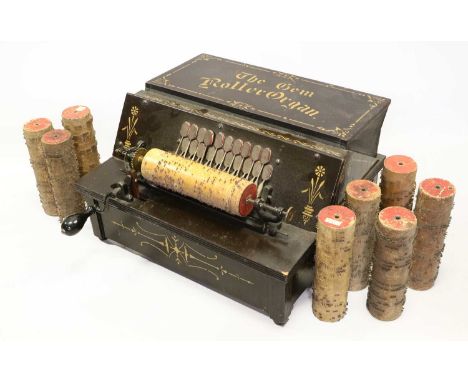 A GEM Roller-Organ typical 20-note reed action, sprung cob carriage and crank operation, in ebonised finished case with gilt 