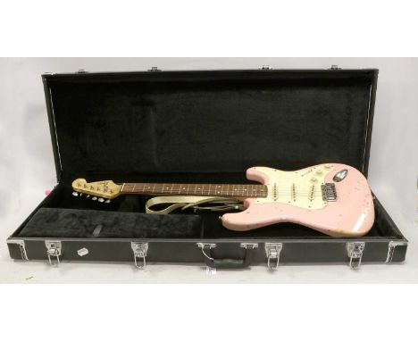 Fender Squier Stratocaster no.CY07072230 (2000) with pink body and pearloid scratchplate (numerous indents/loss) in hard case