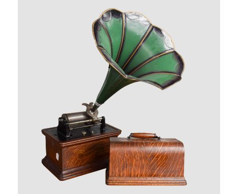 A Graphophone Phonograph with Graphophone reproducer, last pat. date 1905, black finished body in oak case with banner transf