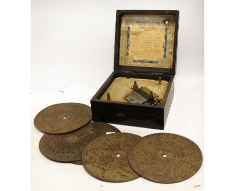 A 5.3/4-Inch Symphonion Manivelle  Disc Musical Box with single comb, patterned bedplate and tri-language label inside lid, i