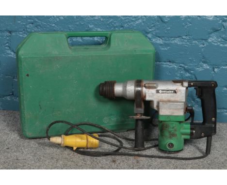 A Hitachi hammer drill with case.  