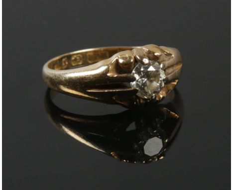 An 18ct gold diamond solitaire ring in claw setting. Approximately 0.5ct diamond. Size I 1/2. 3.2g.  Inclusion in stone.