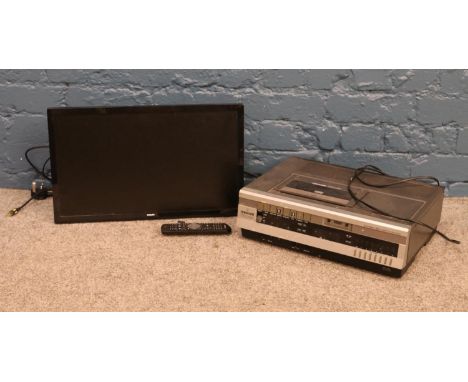 A Ferguson VHS recorder and Phillips TV with remote. H:31cm, W:51cm.  