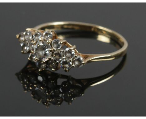 A 9ct gold and clear stone cluster ring. Size R. 2.22g.  