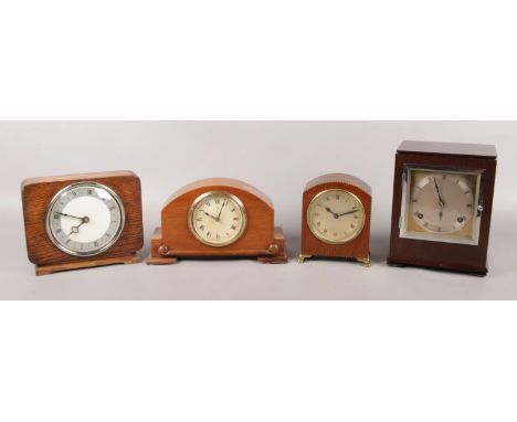 Four small mantle clocks, including one example by the Hamburg American Clock Company.  