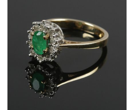 A 9ct gold diamond and green coloured stone cluster ring. Size L. 3.2g.  