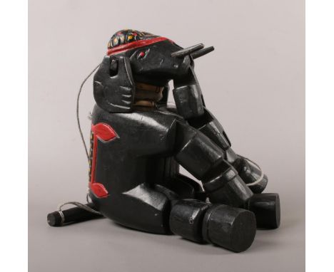 A vintage wooden elephant marionette.  