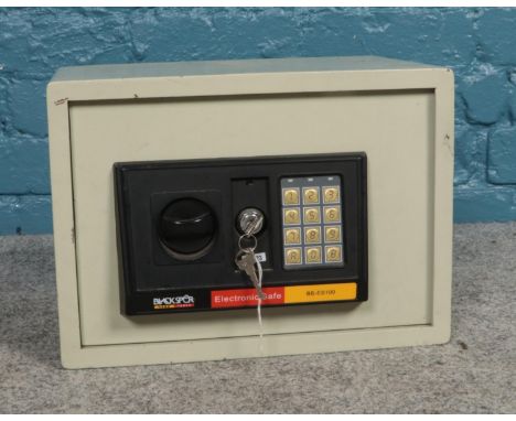 A Blackspur ES100 electronic safe with instruction manual and override key. (35cm x 25cm x 25cm)  