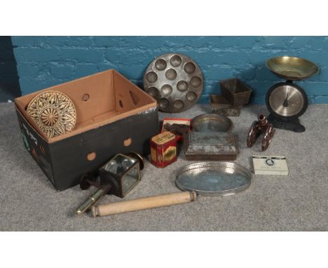 A box of mostly metalwares. Comprising of vintage baking tins, salter weighing scale, keys and a carriage lamp etc.  