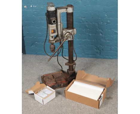An AEG 110 volt industrial pillar drill on stand along with a fuse box, etc.  