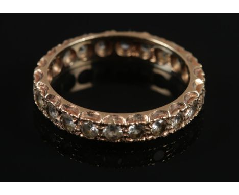 A 9ct gold diamond full eternity ring. Size P1/2. Assayed in Birmingham. Total weight: 2.58g.  