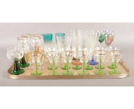 A tray of assorted vintage drinking glasses. To include coloured stems, etched glasses and green with gold rims etc.  