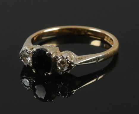 An 18ct gold diamond and sapphire ring. Size M. 2.8g.  