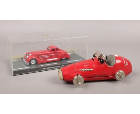 A vintage Schuco tin plate 1070 grand prix racer. To include a detective comics #27 batman die cast model car.  
