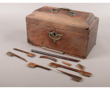An antique mahogany tea caddy for restoration.  