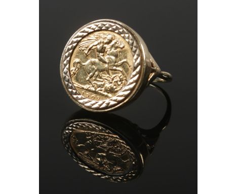 An Edwardian half sovereign ring, 1907, in 9ct gold shank. Size P. 10.06g.  