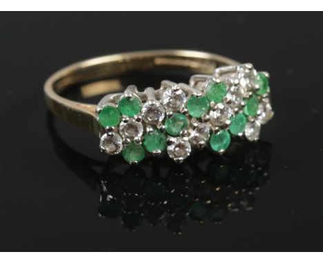 A 9ct gold emerald and cubic zirconia ring. Size O. Total weight: 2.33g.  