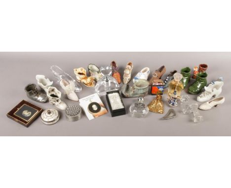 A large collection of miniature glass and ceramic shoes, together with a series of dressing table items.  