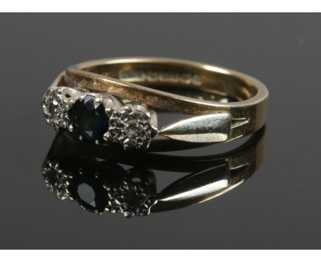 A 9ct gold sapphire and diamond ring. Size L. 2.92g.  