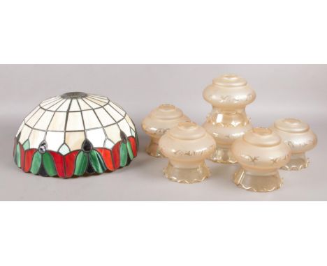 A set of six glass light shades with frilled edging and etched decoration, together with Tiffany style shade.  