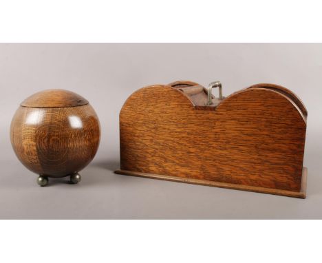 An Art Deco Globe Round Oak Tea Caddy with Liner Circa 1930s and an oak keepsake box with curved sliding tops. Box: H:15cm, W