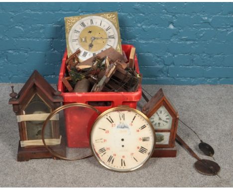 A large quantity of clock restorers parts, including A. Herbert, London longcase clock face, clock movements, weights and cuc