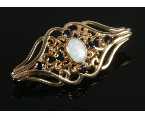 A 9ct gold opal &amp; sapphire openwork brooch. 4.00g.  