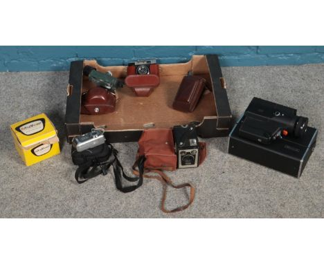 A box mostly photographic equipment. Including Kodak Brownie, theodolite, Halina viewer, etc.  