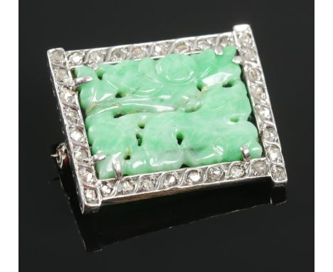 A white metal Art Deco Jade &amp; Diamond brooch. H:2.8cm W: 2.3cm. Total weight: 7.60g.  