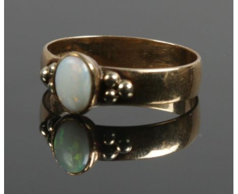 A 9ct gold opal ring. Size P 1/2. 2.71g.  