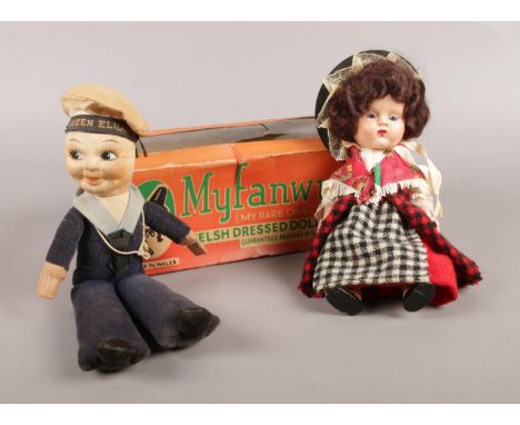 Two vintage dolls: a boxed Myfanwy welsh dressed doll, together with a Queen Elizabeth sailor doll.  Tear to the top of the r