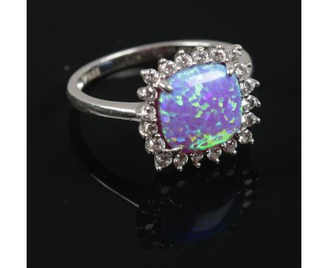 A Sterling Silver Cubic Zirconia and opalescent stone ring. Stamped 925. Size O. Total weight 2.91g.  Boxed.