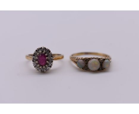 A ruby and diamond gold cluster ring;&nbsp;together with an opal and diamond chip gold ring, both hallmarked 375. 