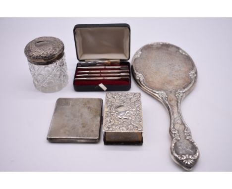 A small quantity of silver and silver mounted items,&nbsp;to include: an engine turned cigarette case and an embossed matchbo