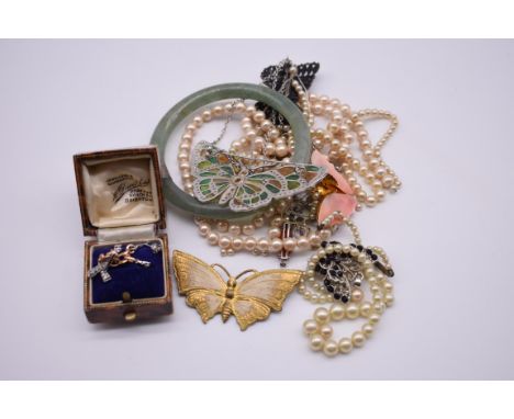 A small group of silver jewellery, to include a butterfly brooch; a pair of earrings, a jade bangle; together with other cost