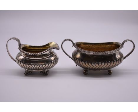 A George III silver twin handled sugar basin, by&nbsp;J.A, London 1799, 9.5cm high; together with a similar milk jug, by Char
