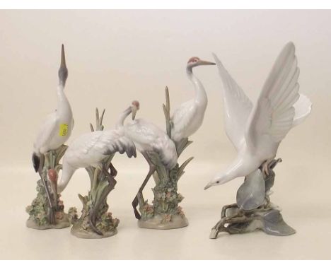 Three Lladro Herons also a Seagull. Condition report: see terms and conditions'.
