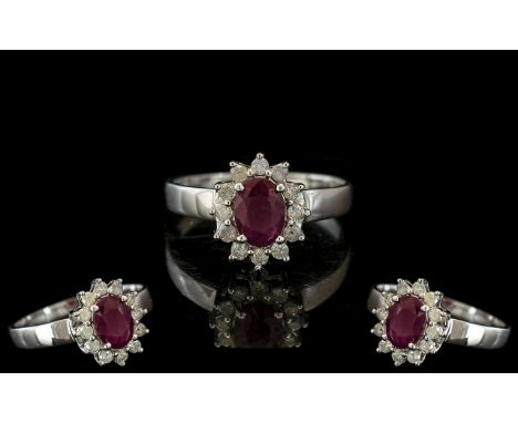 Ladies - 14ct White Gold Diamond and Ruby Set Ring, Marked 14ct to Interior of Shank. The Central Ruby Surrounded by 12 Small