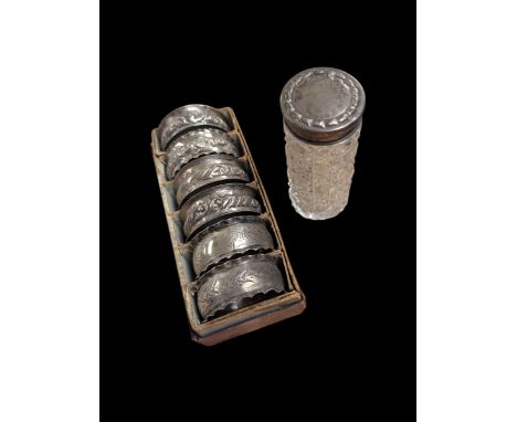 Six silver napkin rings, together with a silver topped cut glass jar, all hallmarkedCondition Report:Approx 1.4 ozt (44 grams