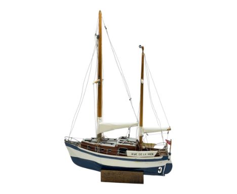 Scratch built model yacht 'Rue de la mer', with painted blue and white hull, with acrylic case, model H67.5cm